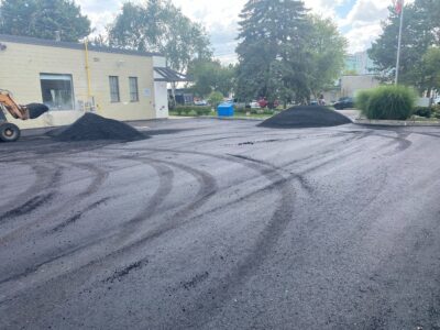 asphalt paving for factory parking lot in progress