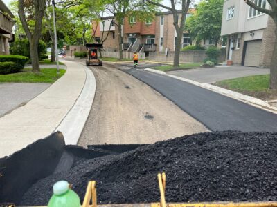 crew-laying-asphalt-for-driveway