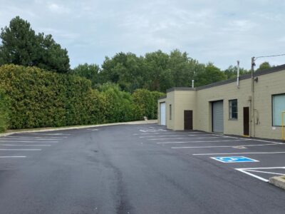 fresh-asphalt-paving-job-for-factory-parking-lot