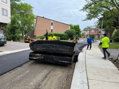 machine laying new asphalt