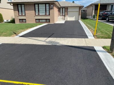 new driveway with concrete borders installed