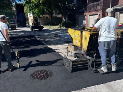 pavers installing new asphalt