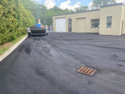 paving-machine-working-near-factory