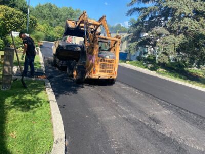 workers-paving-factory-parking-lot
